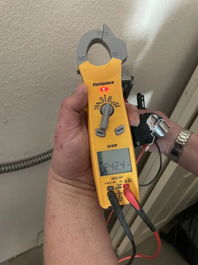 Voltage testing with clamp meter during Electrical Installation Services in Fairview